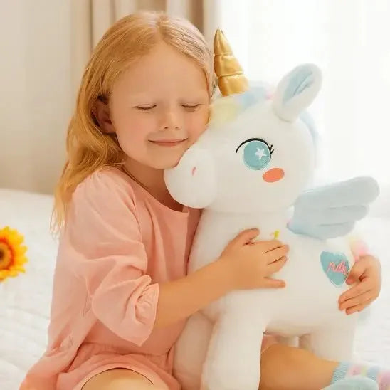 Détails des finitions de la peluche d'éveil licorne