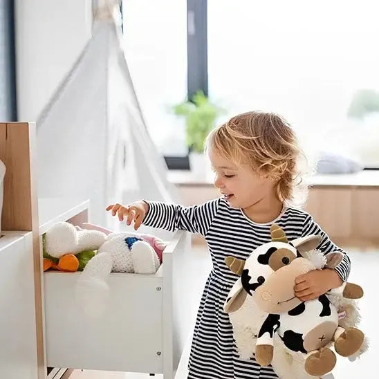 Détails des finitions de la peluche d'éveil vache