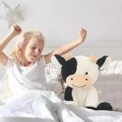 Grande peluche bovine pour éveil matinal joyeux enfantin