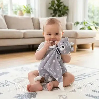 Doudou ours bébé qui fait ses dents