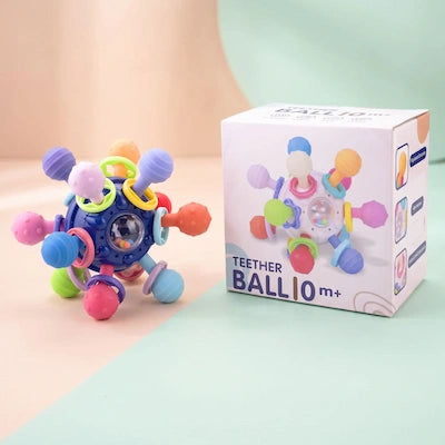 le hochet balle à coté de sa boîte d'emballage