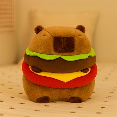 Peluche capybara hamburger sur canapé